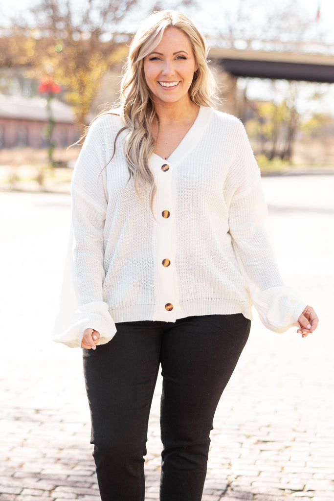 white cardigan sweater outfit