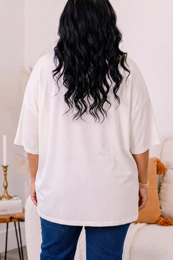 Chic Soul plus size clothing, ivory short sleeve boyfriend tee with patchwork pumpkin in the middle and a bow on the stem
