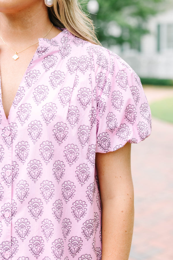 Plus Size pink mini dress with a purple floral block print, puff sleeves, and a tiered skirt.