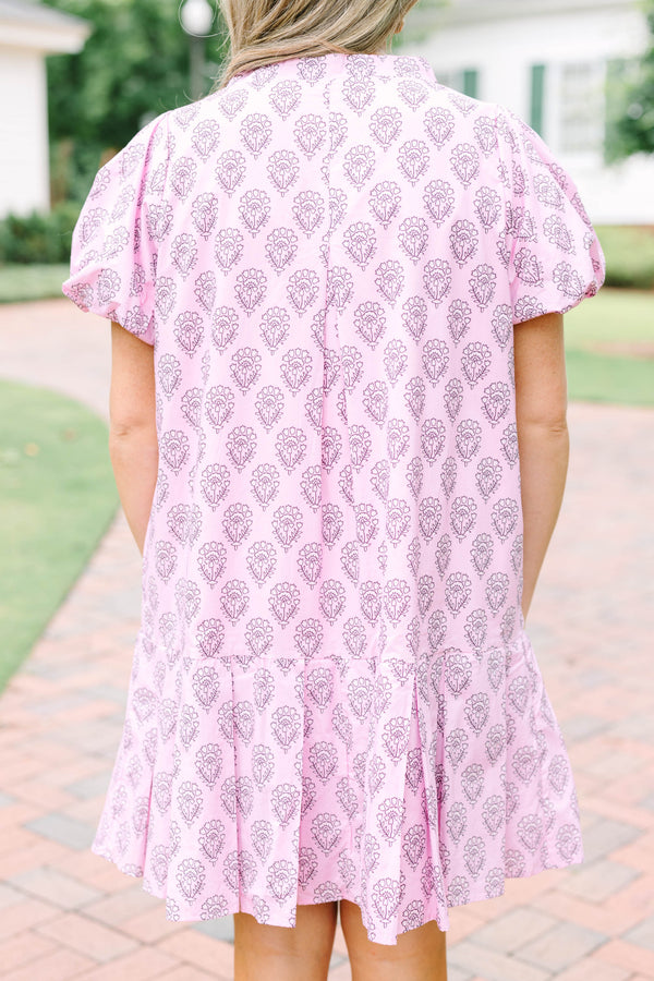 Plus Size pink mini dress with a purple floral block print, puff sleeves, and a tiered skirt.