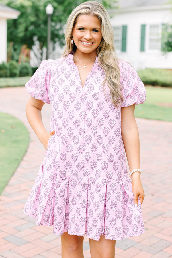 Plus Size pink mini dress with a purple floral block print, puff sleeves, and a tiered skirt.