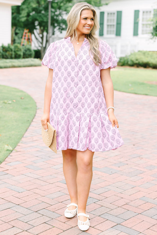 Plus Size pink mini dress with a purple floral block print, puff sleeves, and a tiered skirt.