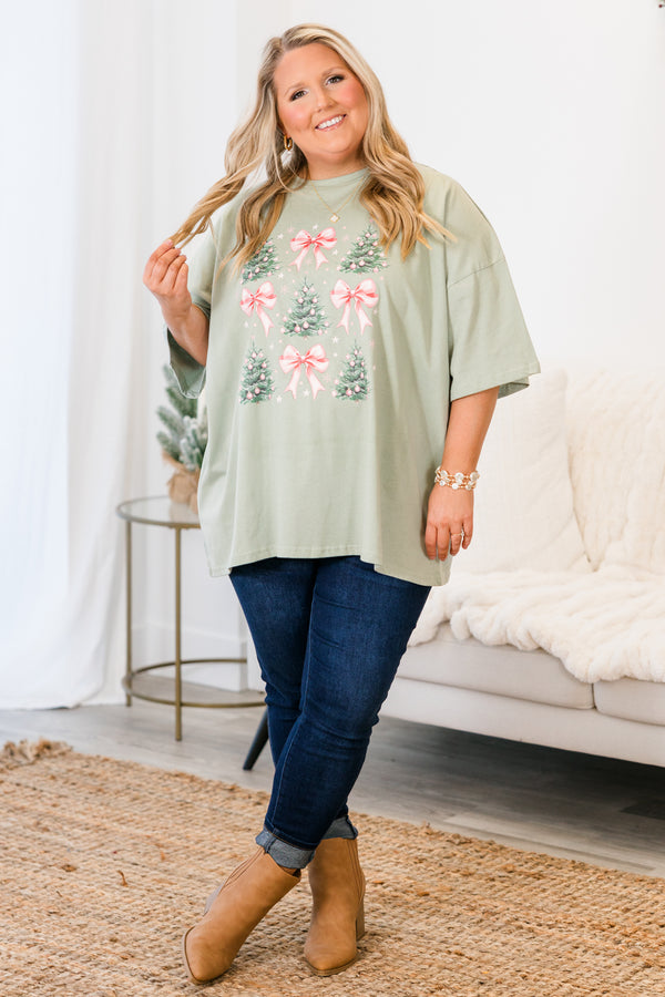 Chic Soul plus size clothing, short-sleeve light sage green graphic boyfriend tee with scoop-neckline and graphic art of pink bows and christmas trees with pink ornaments