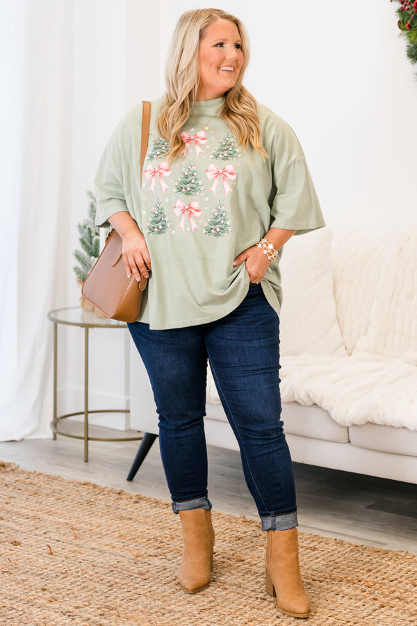 Chic Soul plus size clothing, short-sleeve light sage green graphic boyfriend tee with scoop-neckline and graphic art of pink bows and christmas trees with pink ornaments