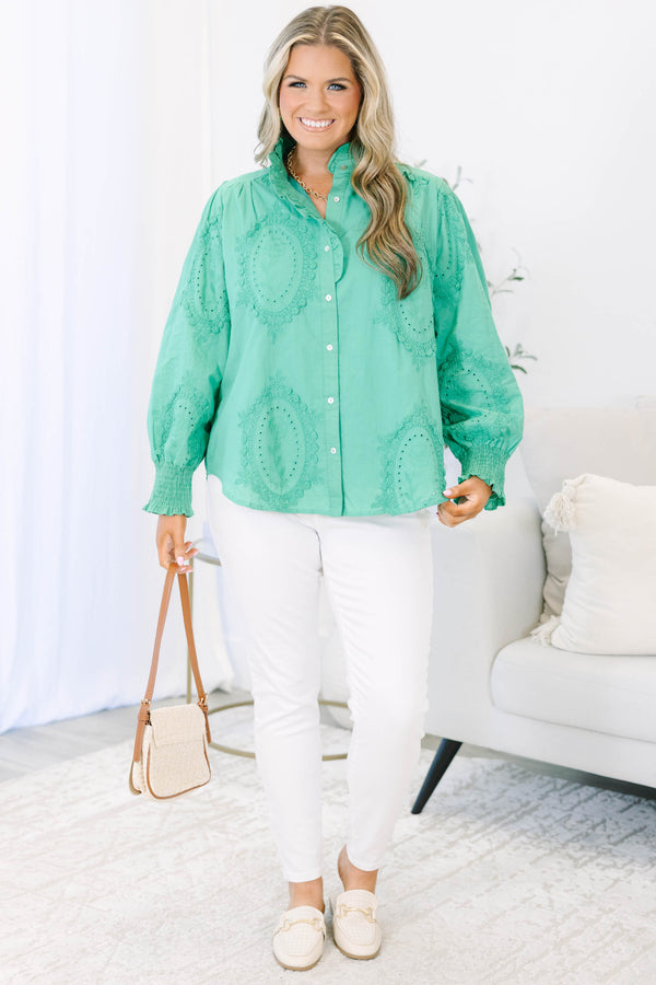 Plus size kelly green button-down top with tonal embroidery, ruffle collar, and smocked cuffs.