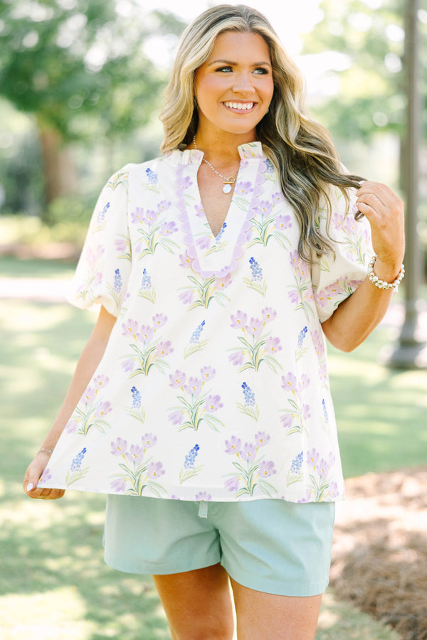 Plus Size cream floral top with puff sleeves, ric rac V-neckline, and light green shorts.
