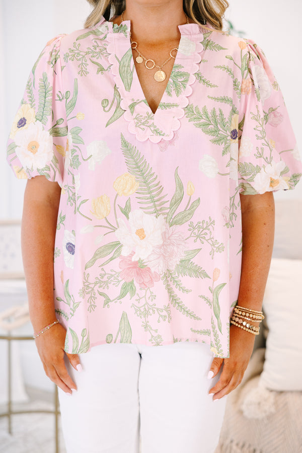 Plus Size light pink floral top with a scalloped V-neckline and short puff sleeves.
