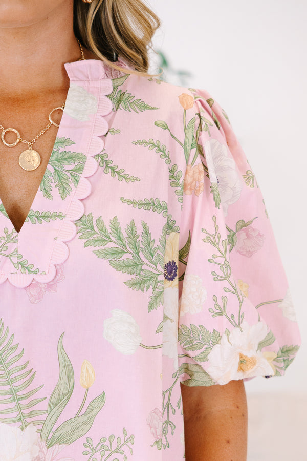 Plus Size light pink floral top with a scalloped V-neckline and short puff sleeves.