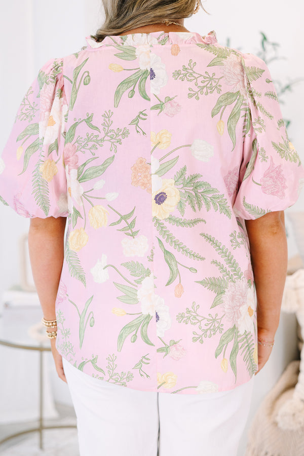 Plus Size light pink floral top with a scalloped V-neckline and short puff sleeves.