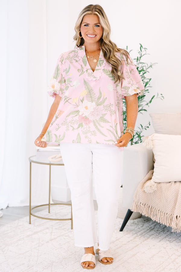 Plus Size light pink floral top with a scalloped V-neckline and short puff sleeves.