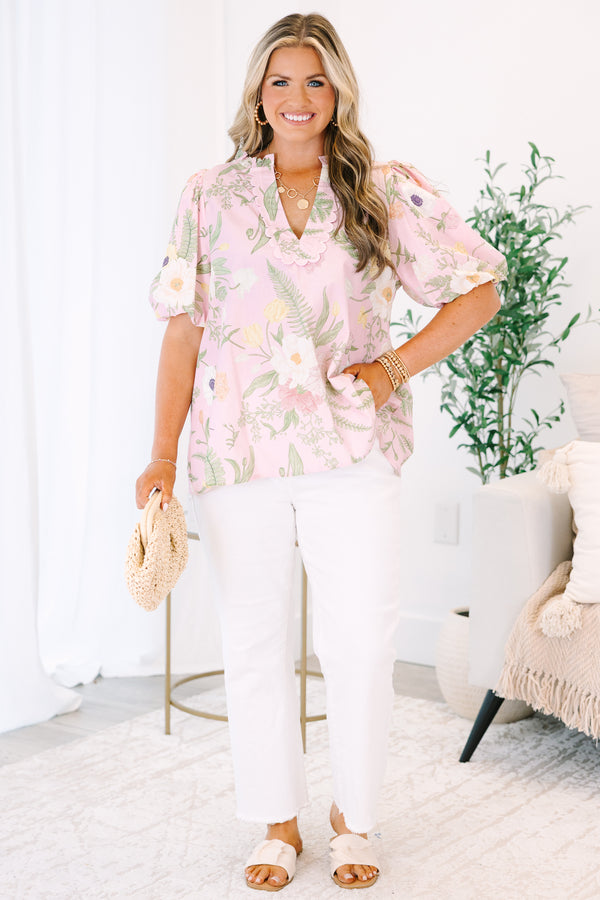 Plus Size light pink floral top with a scalloped V-neckline and short puff sleeves.
