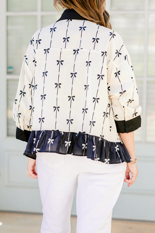 Chic Soul plus size clothing, quarter-long-sleeve beige and black bow collared and button-down top with a pocket on the bodice and a subtle ruffling along the hem 