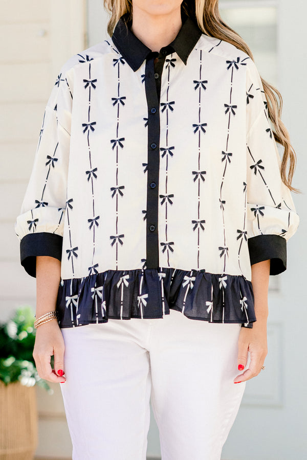 Chic Soul plus size clothing, quarter-long-sleeve beige and black bow collared and button-down top with a pocket on the bodice and a subtle ruffling along the hem 