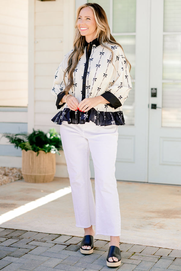 Chic Soul plus size clothing, quarter-long-sleeve beige and black bow collared and button-down top with a pocket on the bodice and a subtle ruffling along the hem 
