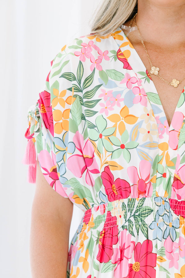 Plus Size pink floral maxi dress with a V-neckline, smocked waist, and tiered skirt.