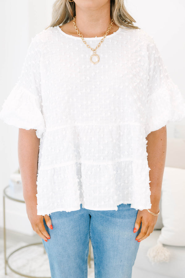 Plus size cream textured swiss dot top with flowy tiered silhouette and ruffle sleeves.