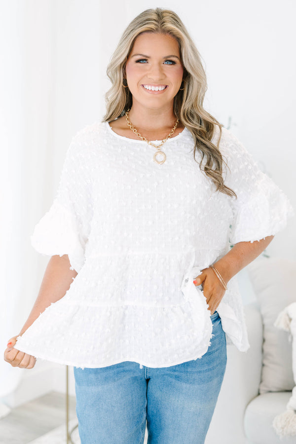 Plus size cream textured swiss dot top with flowy tiered silhouette and ruffle sleeves.