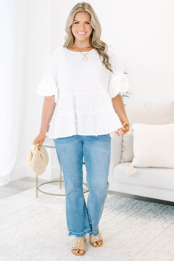 Plus size cream textured swiss dot top with flowy tiered silhouette and ruffle sleeves.