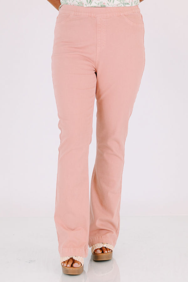 Plus Size rose-colored pull-on jeggings with a flared leg and elastic waistband.