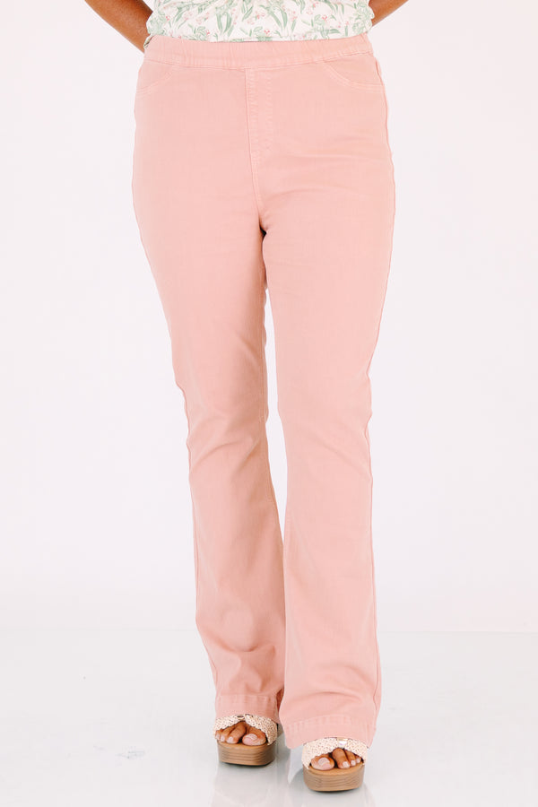 Plus Size rose-colored pull-on jeggings with a flared leg and elastic waistband.