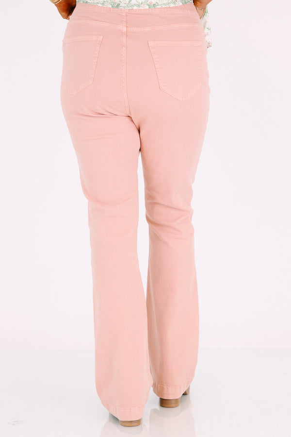 Plus Size rose-colored pull-on jeggings with a flared leg and elastic waistband.