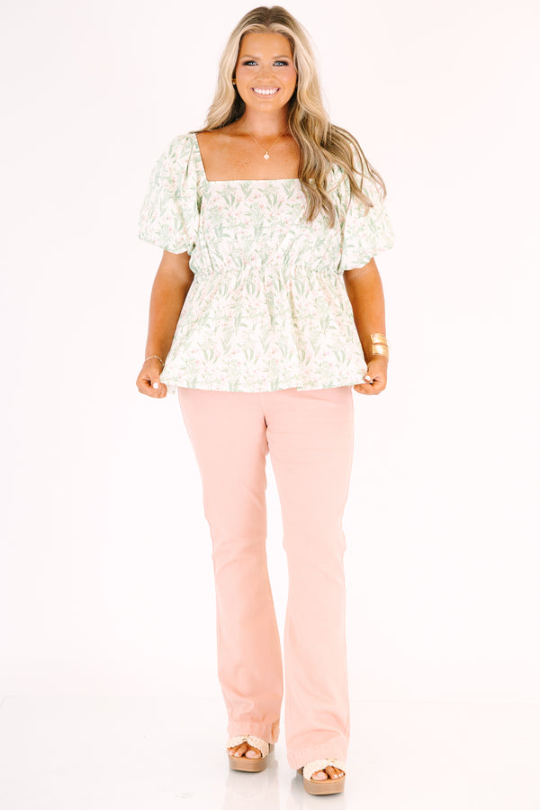 Plus Size rose-colored pull-on jeggings with a flared leg and elastic waistband.