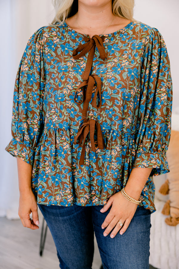 Chic Soul plus size clothing, brown floral top with long sleeves and three brown bow details going down the center of the shirt 