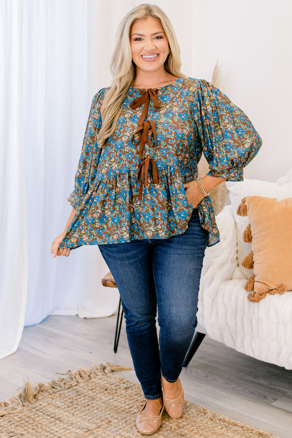 Chic Soul plus size clothing, brown floral top with long sleeves and three brown bow details going down the center of the shirt 