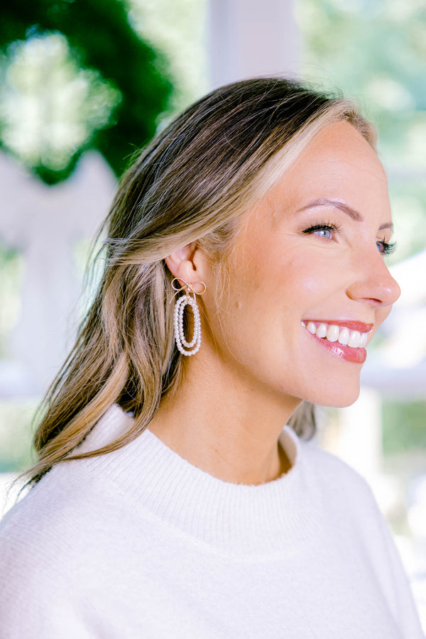 Chic Soul plus size clothing, pearl oval inside of pearl oval dangle earring with gold bow at the top