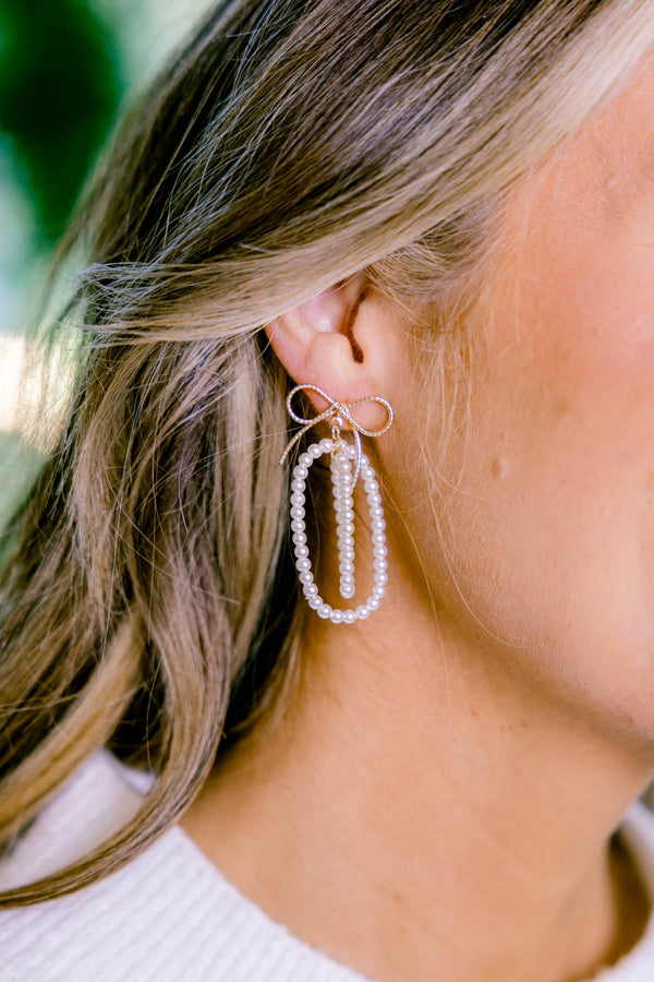 Chic Soul plus size clothing, pearl oval inside of pearl oval dangle earring with gold bow at the top