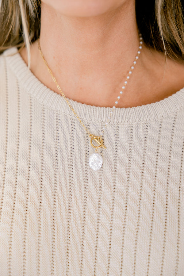 Chic Soul plus size clothing, gold necklace with pearl detailing on one side of the chain as well as a pearl stone detail dropping from the center of the necklace 