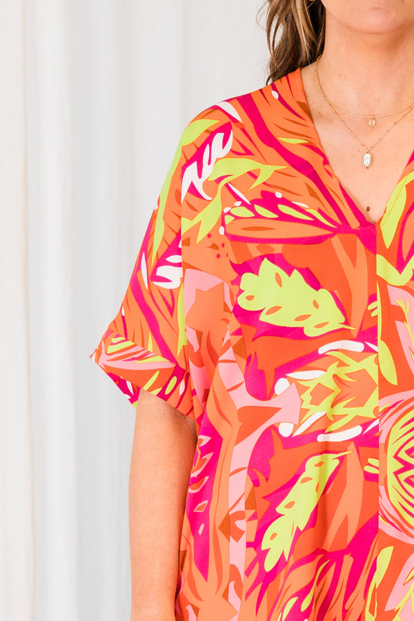 Chic Soul plus size clothing, orange short sleeve top with v-neckline and pink and yellow tropical details