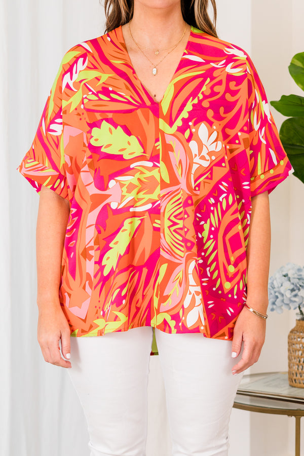 Chic Soul plus size clothing, orange short sleeve top with v-neckline and pink and yellow tropical details