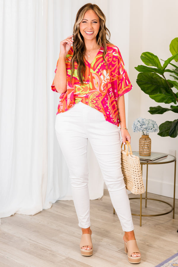 Chic Soul plus size clothing, orange short sleeve top with v-neckline and pink and yellow tropical details