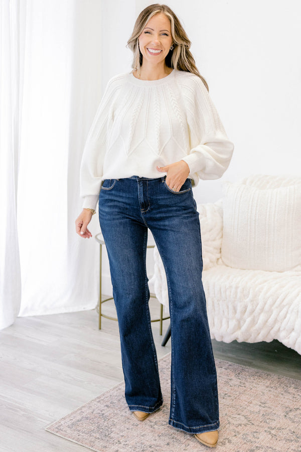 Chic Soul plus size clothing, dark wash bootcut jeans with a slightly distressed hem
