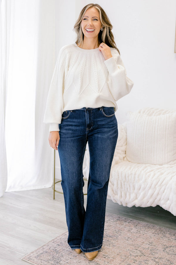 Chic Soul plus size clothing, dark wash bootcut jeans with a slightly distressed hem
