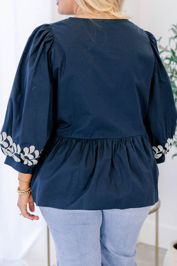 Chic Soul plus size clothing, navy top with floral details at the end of each half sleeve as well as three bows going down the center of the top 