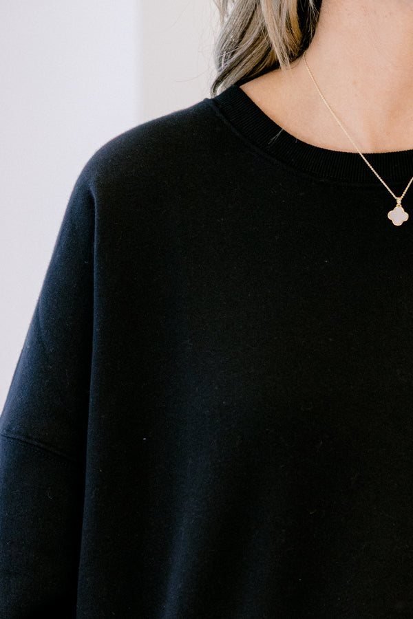 Chic Soul plus size clothing, black long sleeve pullover with round neckline and cuff sleeves with slight bubble sleeves
