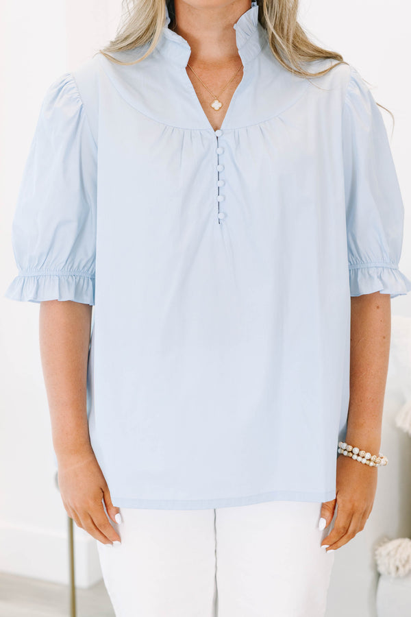 Plus Size light blue short puff sleeve top with a ruffled collar and button-down front.
