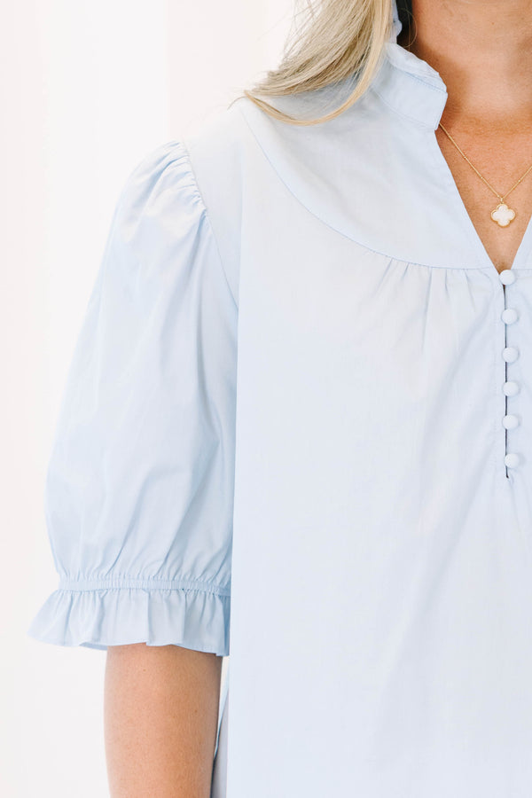Plus Size light blue short puff sleeve top with a ruffled collar and button-down front.