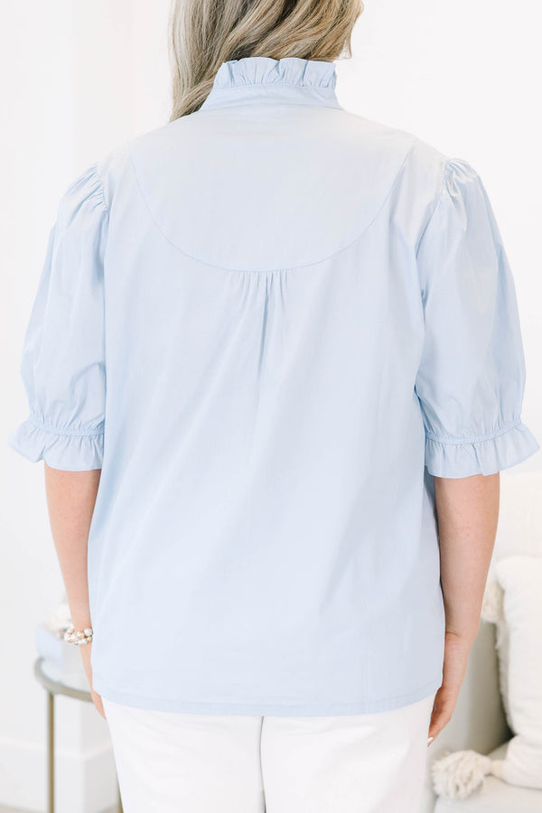 Plus Size light blue short puff sleeve top with a ruffled collar and button-down front.