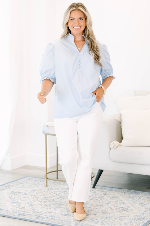 Plus Size light blue short puff sleeve top with a ruffled collar and button-down front.