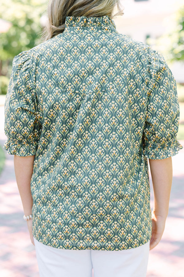 Plus Size green floral print top with puff sleeves, a ruffled collar, and a button-down neckline.