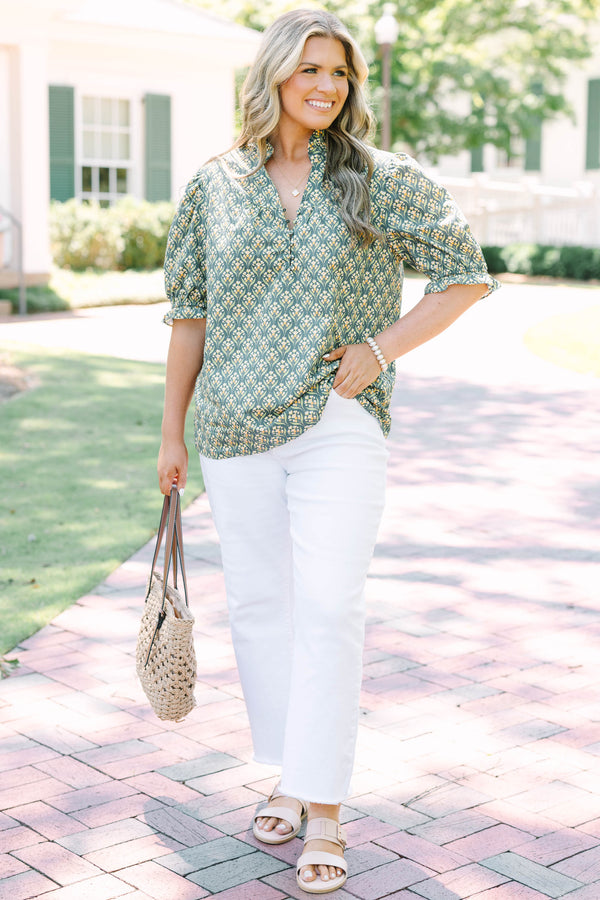 Plus Size green floral print top with puff sleeves, a ruffled collar, and a button-down neckline.
