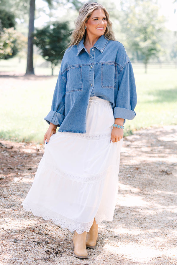 Plus size denim jacket with a relaxed fit, button-down front, and chest pockets.