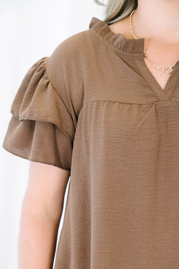 Plus Size brown short-sleeve top with ruffled sleeves, a V-neckline, and a relaxed fit.