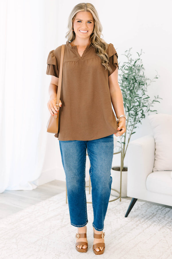Plus Size brown short-sleeve top with ruffled sleeves, a V-neckline, and a relaxed fit.