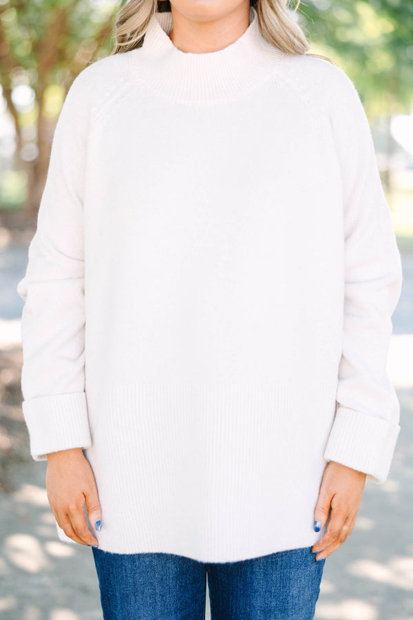 Plus size beige oversized mock neck sweater with a cozy, relaxed fit and ribbed texture.