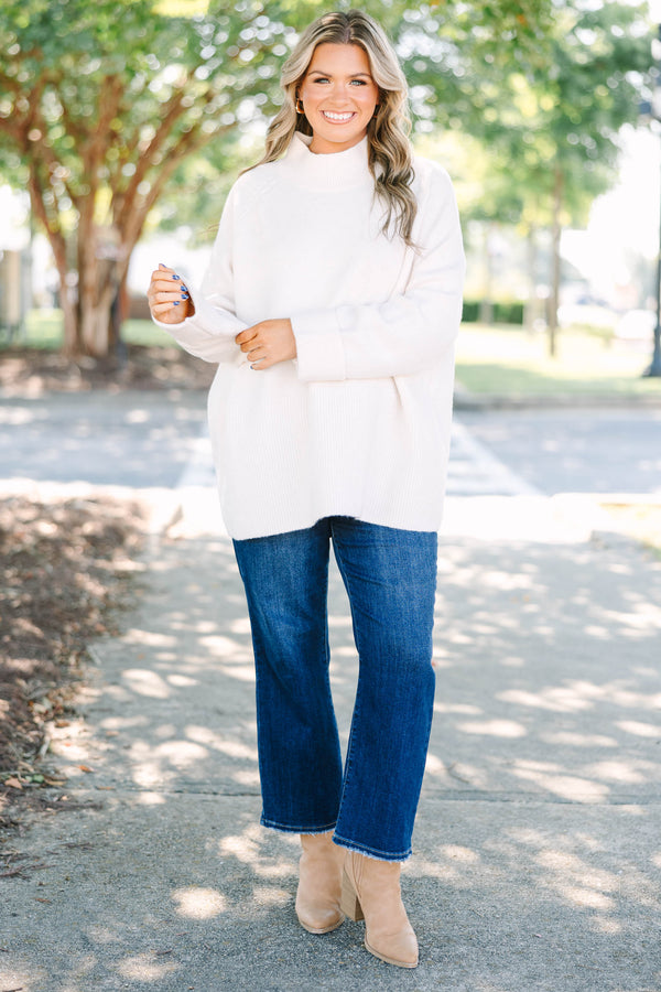 Plus size beige oversized mock neck sweater with a cozy, relaxed fit and ribbed texture.