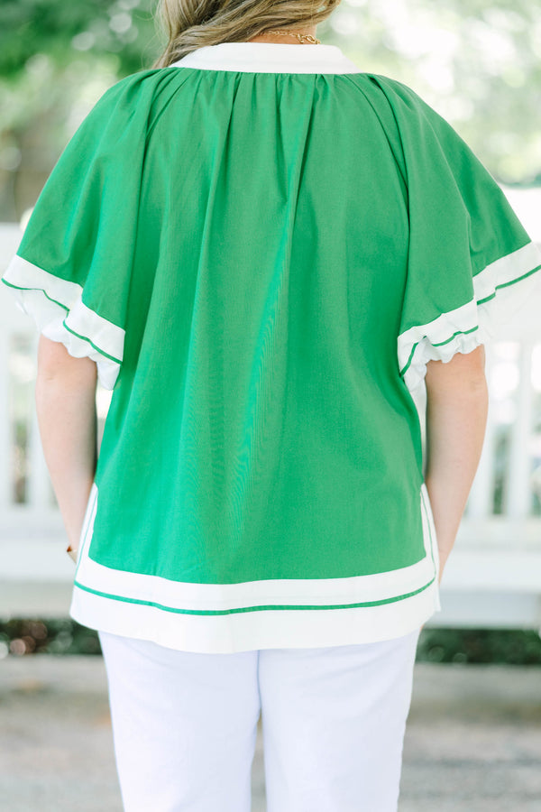 Plus Size kelly green tunic top with white trim, V-neckline, and short flutter sleeves.